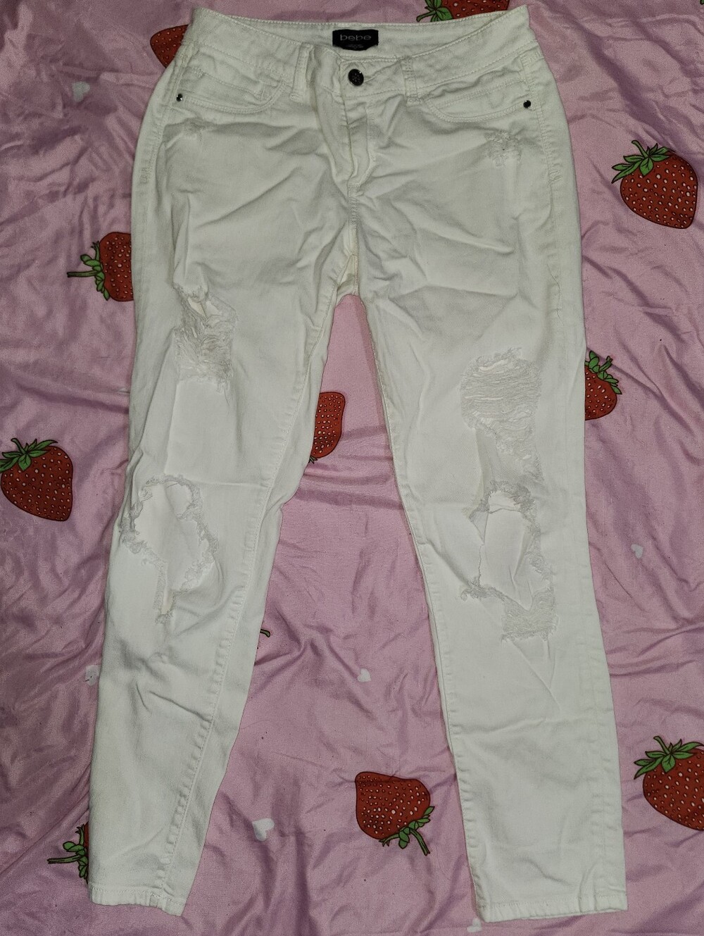 Women's size 28 White Bebe distressed/ripped skinny jeans